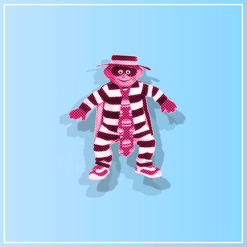 The Hamburglar standing against a blue background